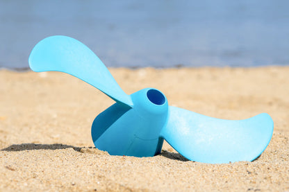 Pièce détachée hélice pour moteur TEMO·1000 sur du sable.